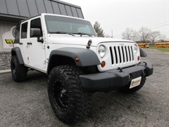 A 2012 Jeep Wrangler Unlimited SPORT 4X4