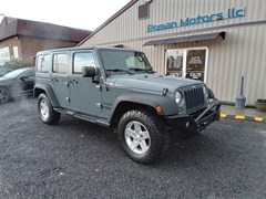 A 2014 Jeep Wrangler Unlimited SPORT