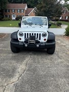 A 2012 Jeep Wrangler Sport Utility