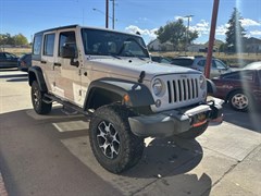 A 2014 Jeep Wrangler Unlimited SPORT